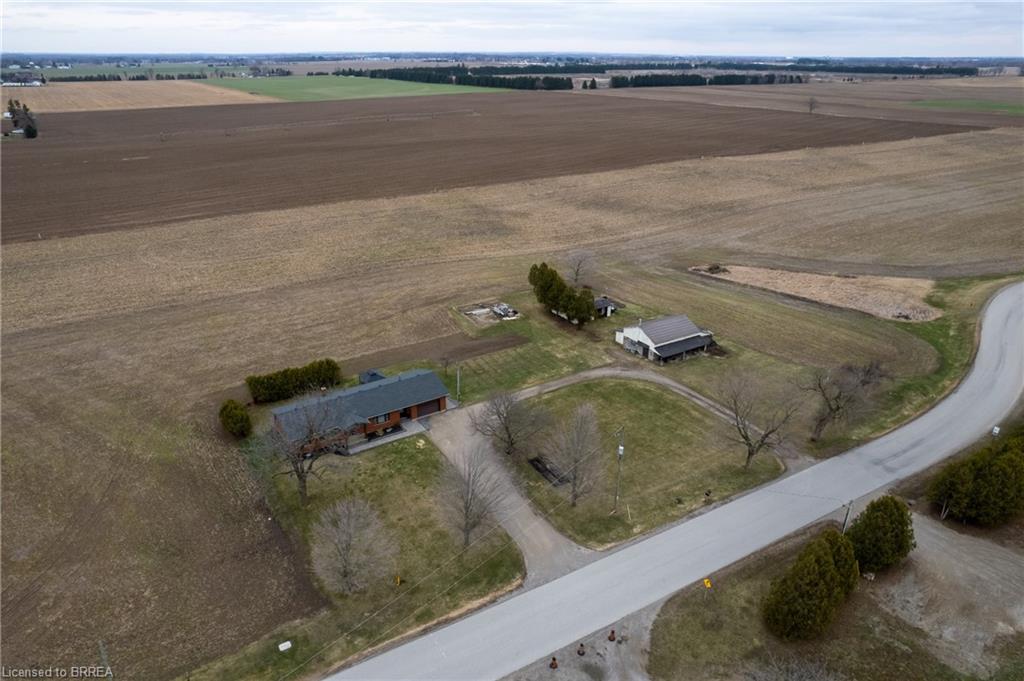 Aerial view of sparsely populated area with farmland