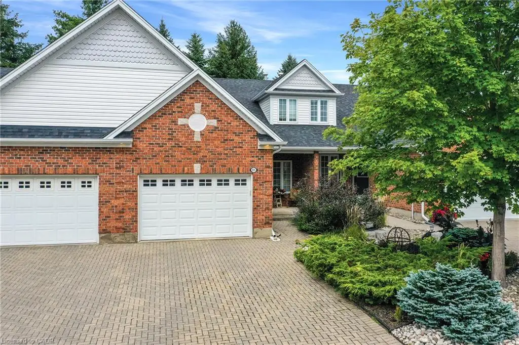 Brick and siding exterior with a dark shingle roof