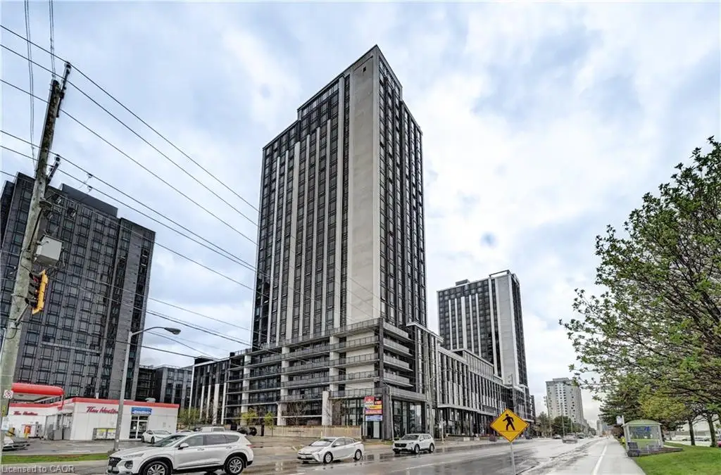 Contemporary high-rise building featuring a multi-story facade, extensive window lines, and integrated balconies