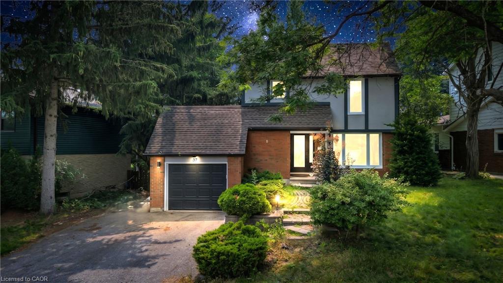 Brick and siding exterior with a dark asphalt shingle roof