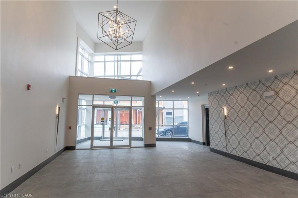 Common area featuring a high ceiling and recessed lighting