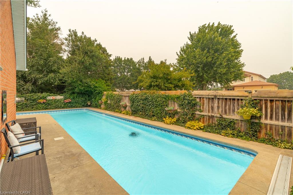 Rectangular in-ground swimming pool with a concrete surround