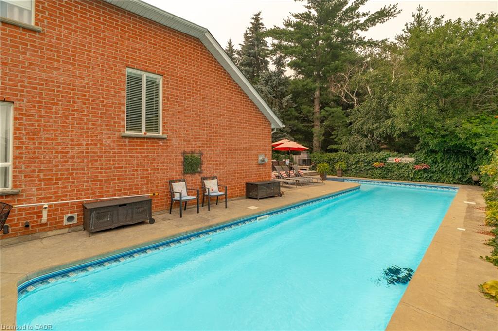 Rectangular inground swimming pool with a concrete surround