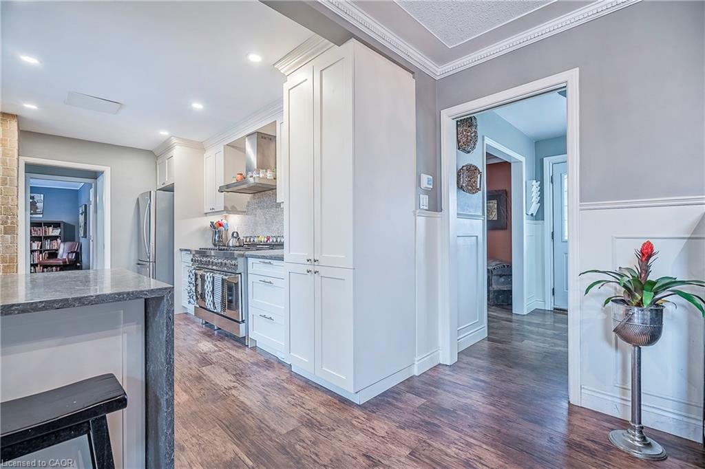 Intersection of kitchen, dining room, looking towards the front foyer.