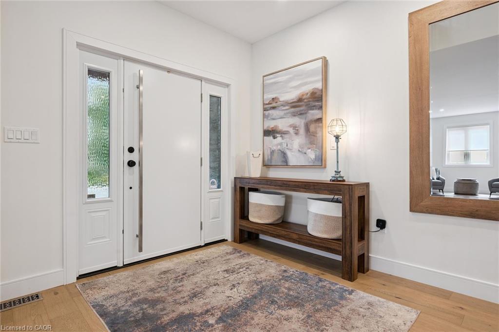 Entry door with frosted side lites and a substantial handle