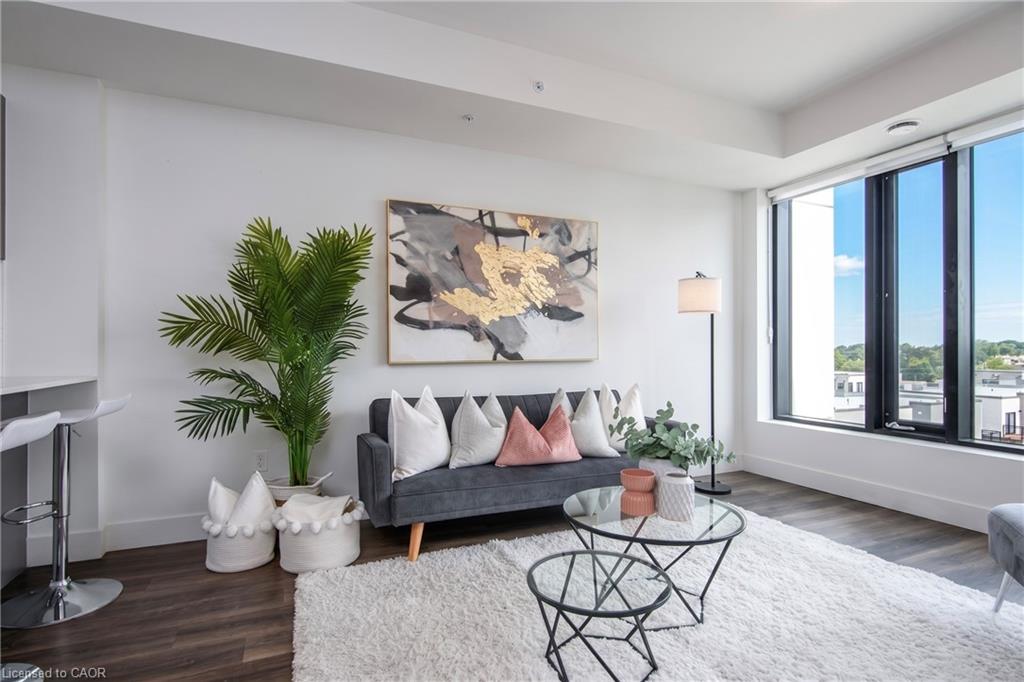 Spacious living area featuring large picture windows,