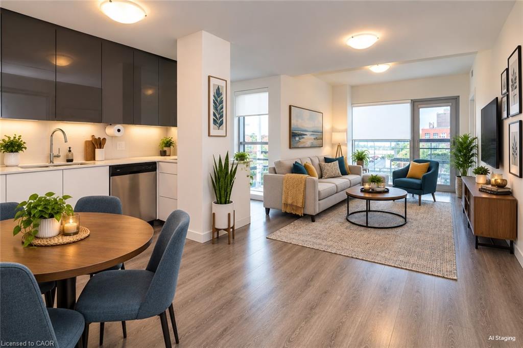 Wood-finish flooring throughout, modern kitchen cabinetry with under-cabinet lighting, stainless steel appliances, and a glass-paneled door leading to an outdoor space