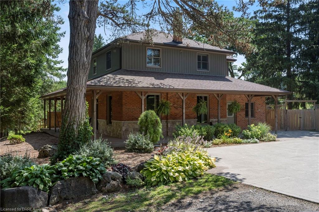 Brick and board and batten exterior with stone accents