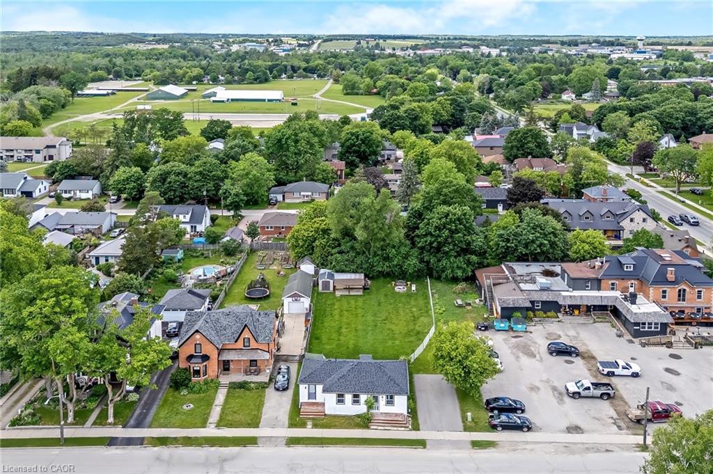Aerial perspective showcasing a residential street with mature trees and established properties