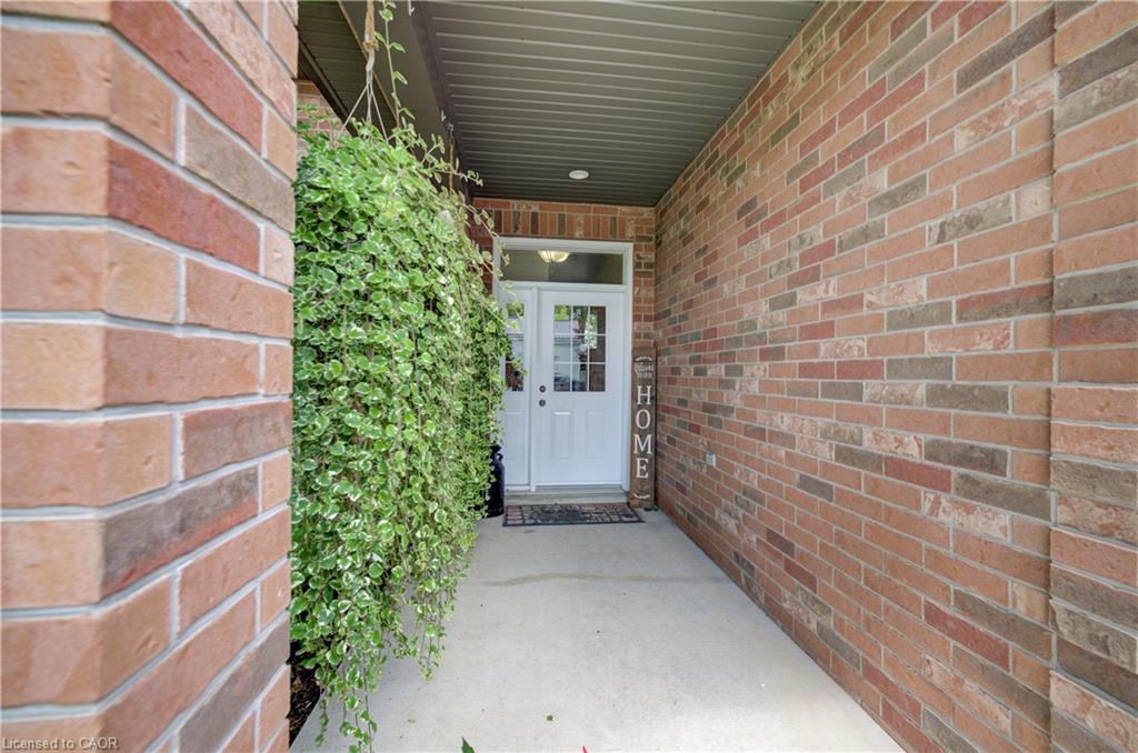 Brick exterior facade featuring a covered entry porch
