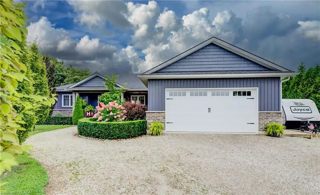 Blue horizontal siding and shake siding exterior with a white garage door