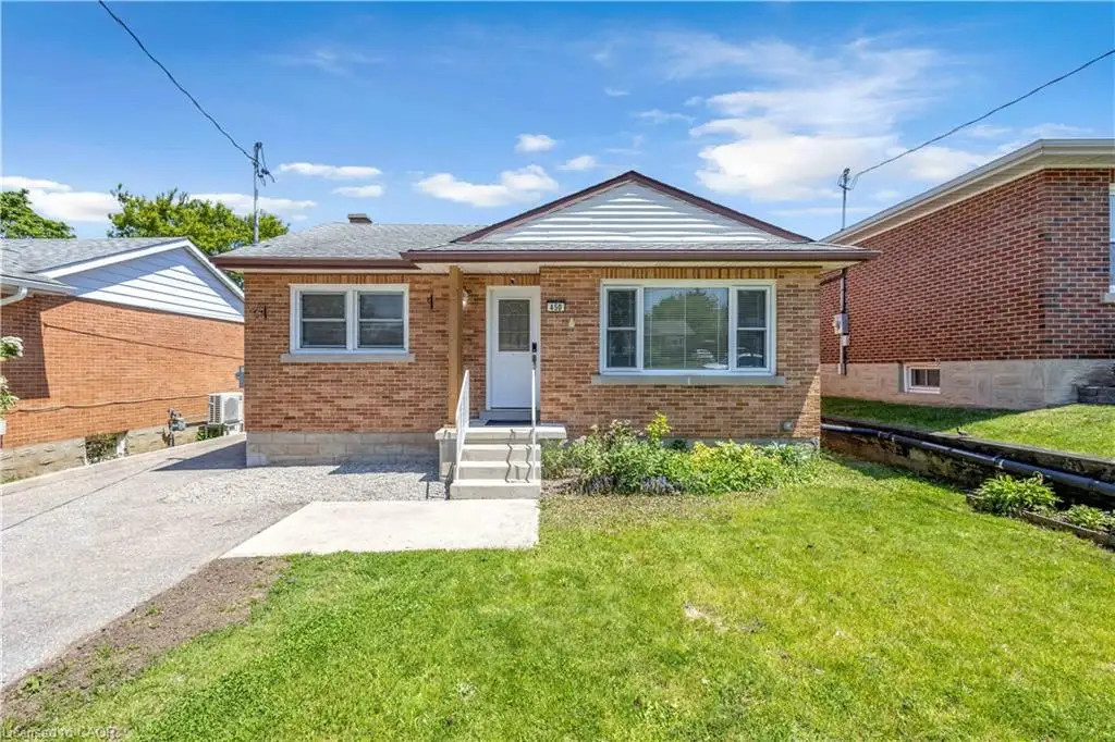 Brick exterior residence featuring a front entry, covered porch, and a pitched roof