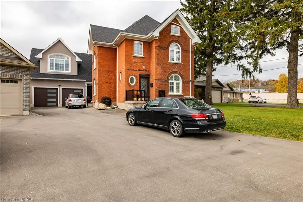 Front of property featuring a front yard and a garage