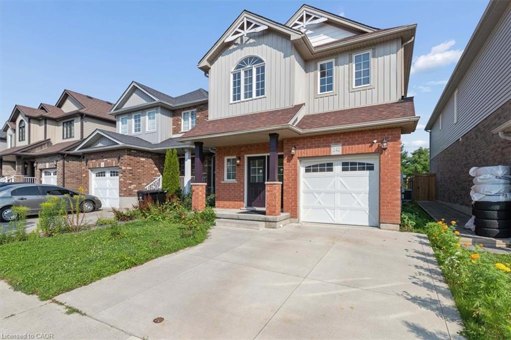 Brick and siding exterior with a single-car garage and concrete driveway