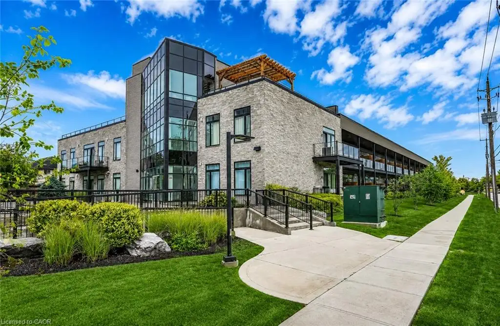 Modern architectural design featuring stone facade, extensive glazing, and private balconies