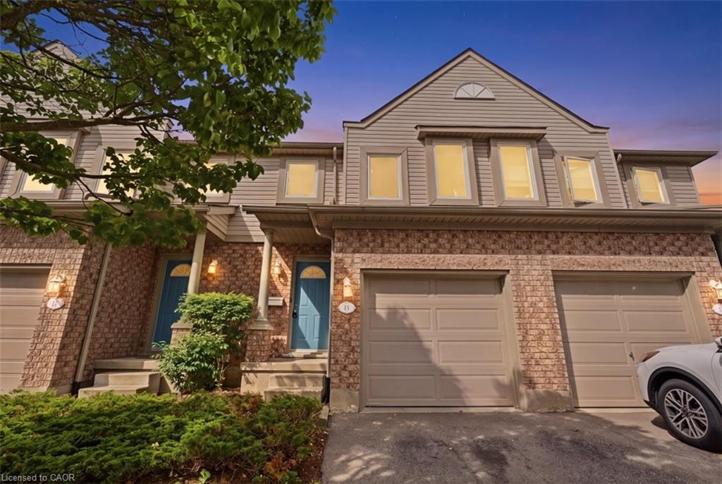 Townhome exterior with brick and siding facade