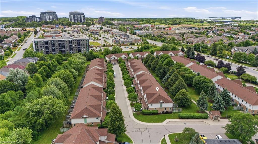 Townhome community featuring mature landscaping and a uniform architectural style
