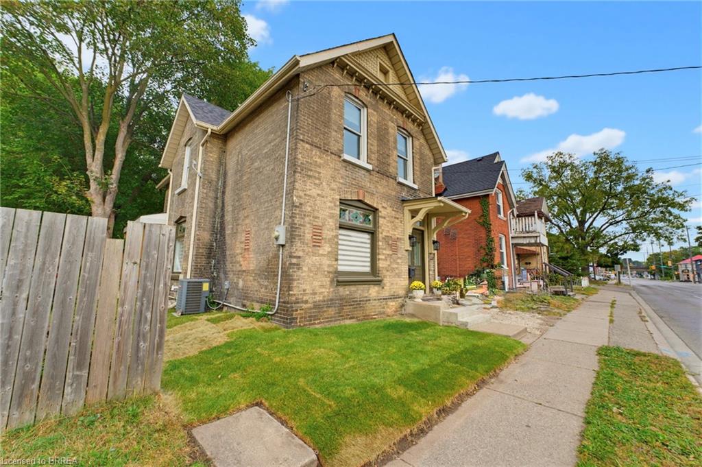 Brick exterior with gabled roofline and covered front entry