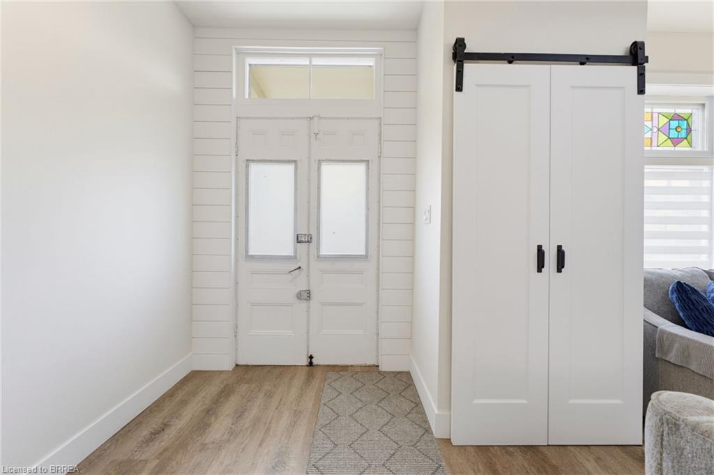 Wood-finish flooring with a decorative area rug