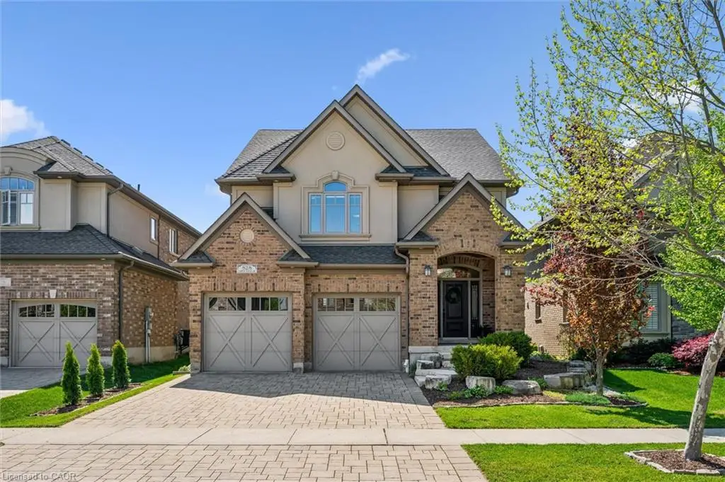 Brick and stucco two-story home with a double garage.