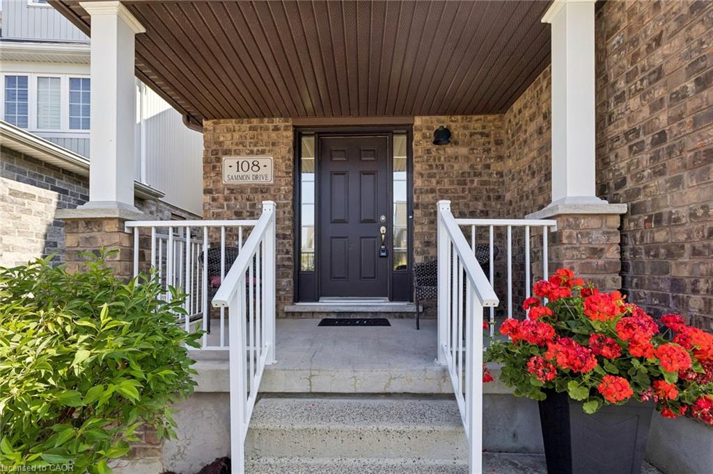 Brick exterior with white railing and columns