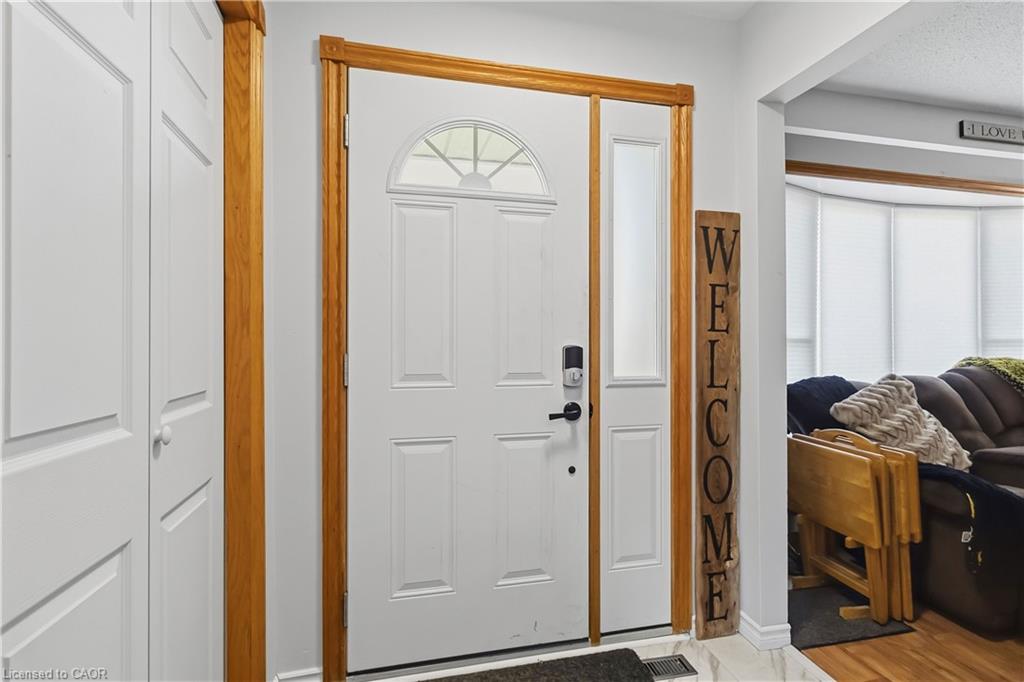 Entryway from the front door with a coat closet