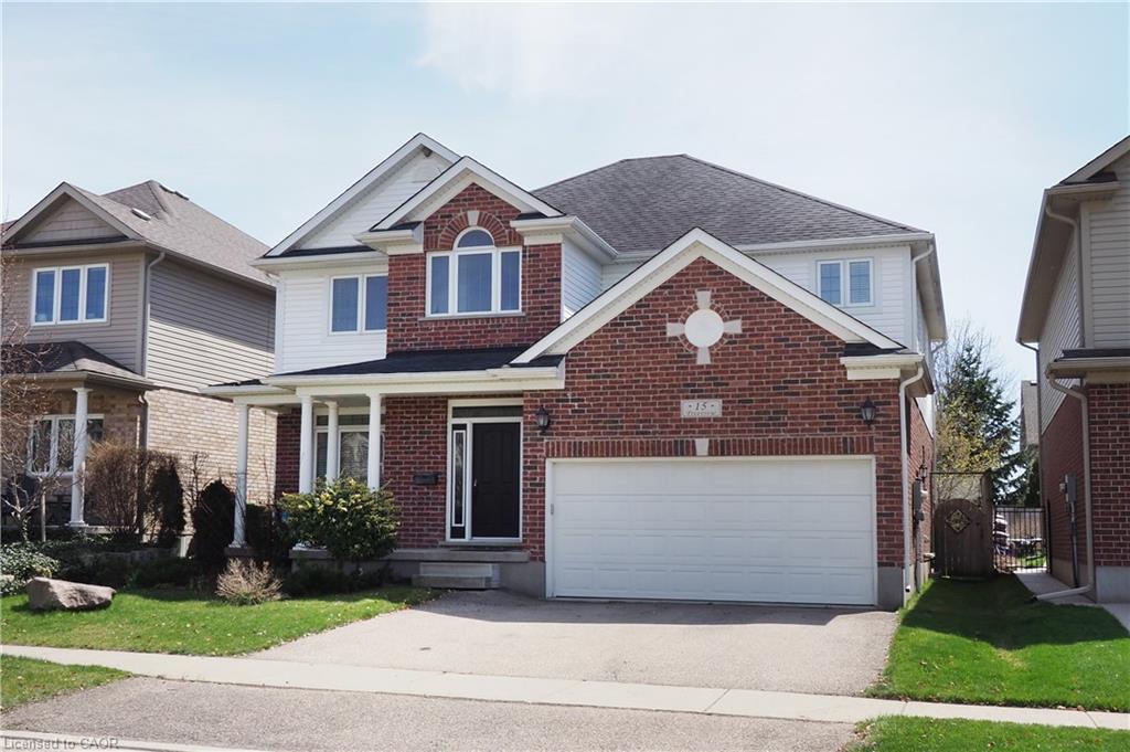Red brick and white siding exterior with an arched window accent