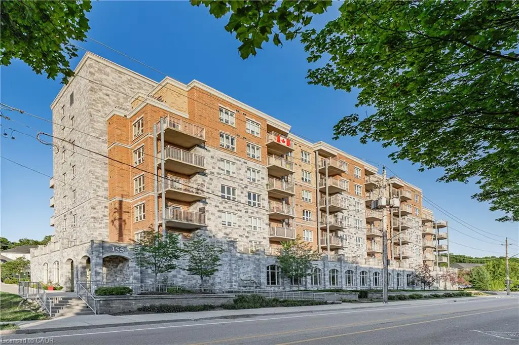 Multi-story residential building featuring a stone and brick facade