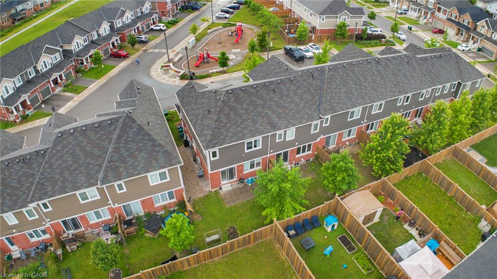 Townhome residences with asphalt shingle roofing and private fenced yards