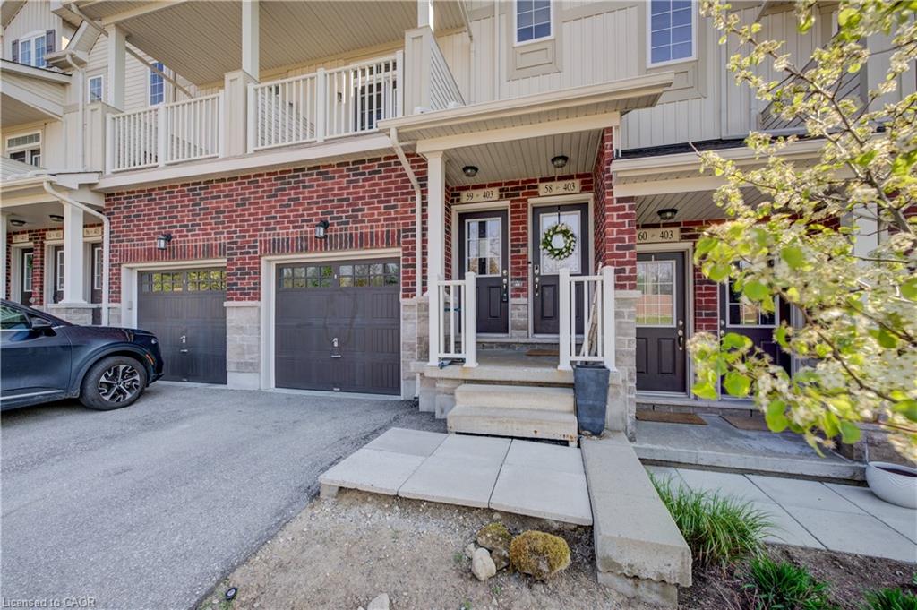 Brick and siding exterior featuring individual entryways with covered porches