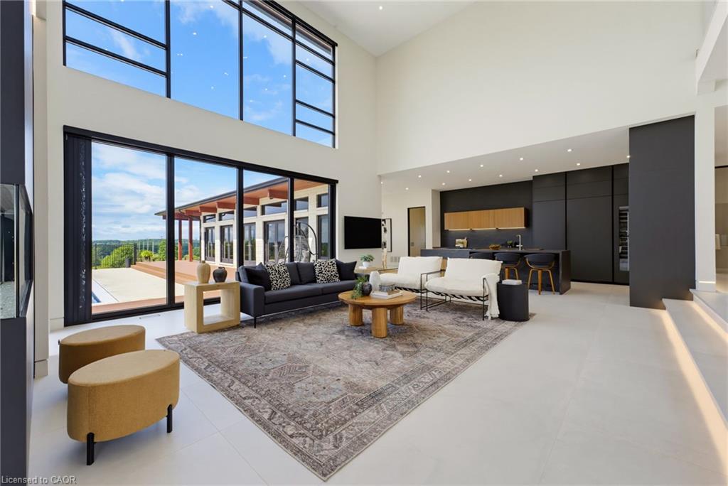 Soaring ceilings with clerestory windows flood this open-concept living space with natural light