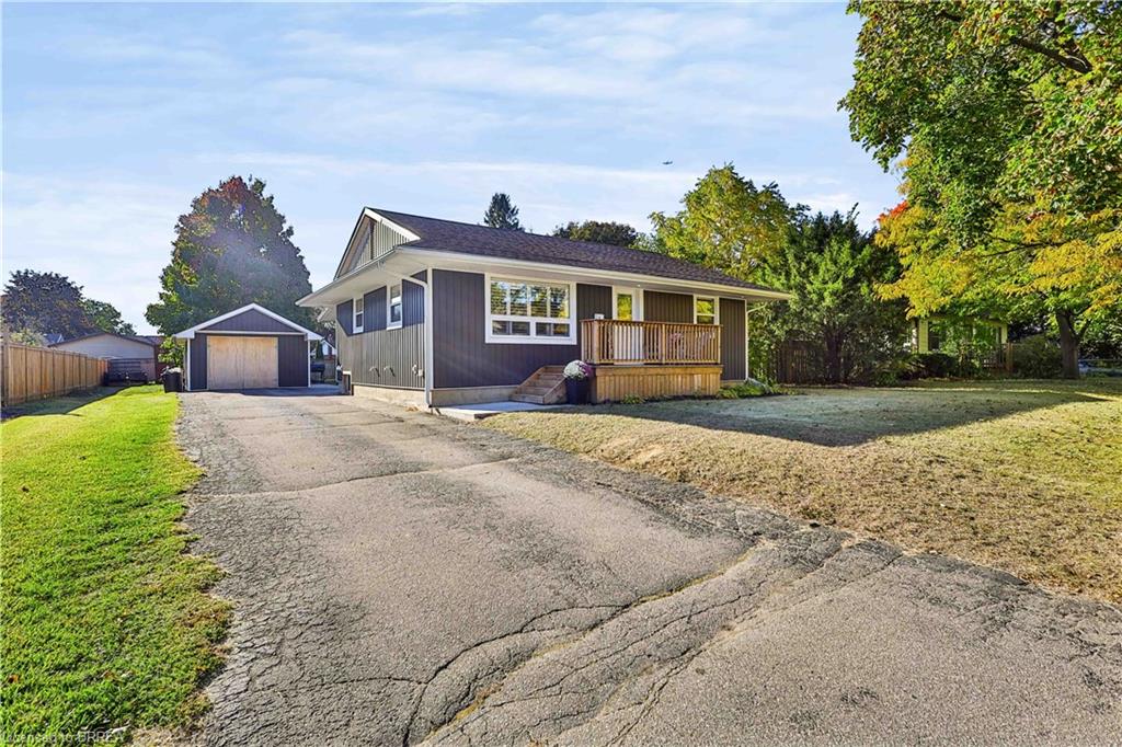 The large driveway leading to detached garage.