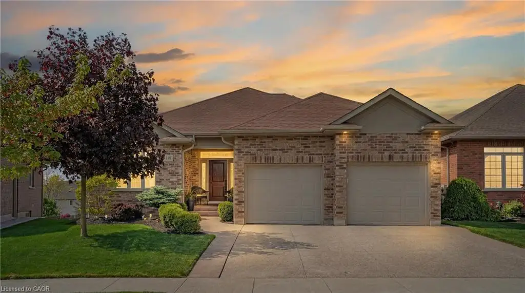 Brick and stone exterior with a dual garage