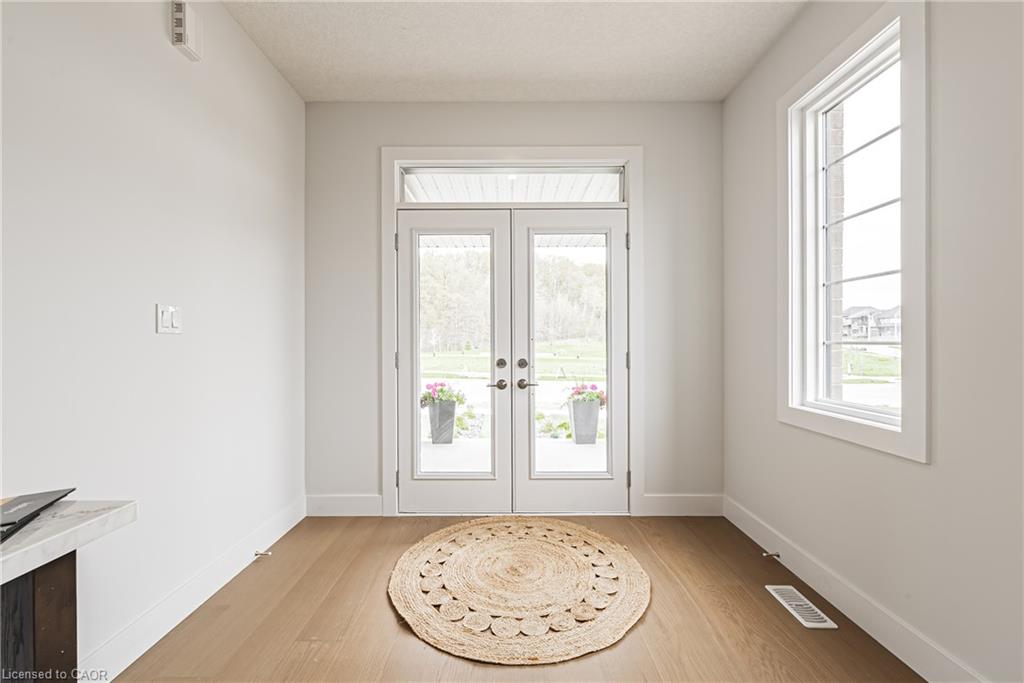 Double French doors with transom window