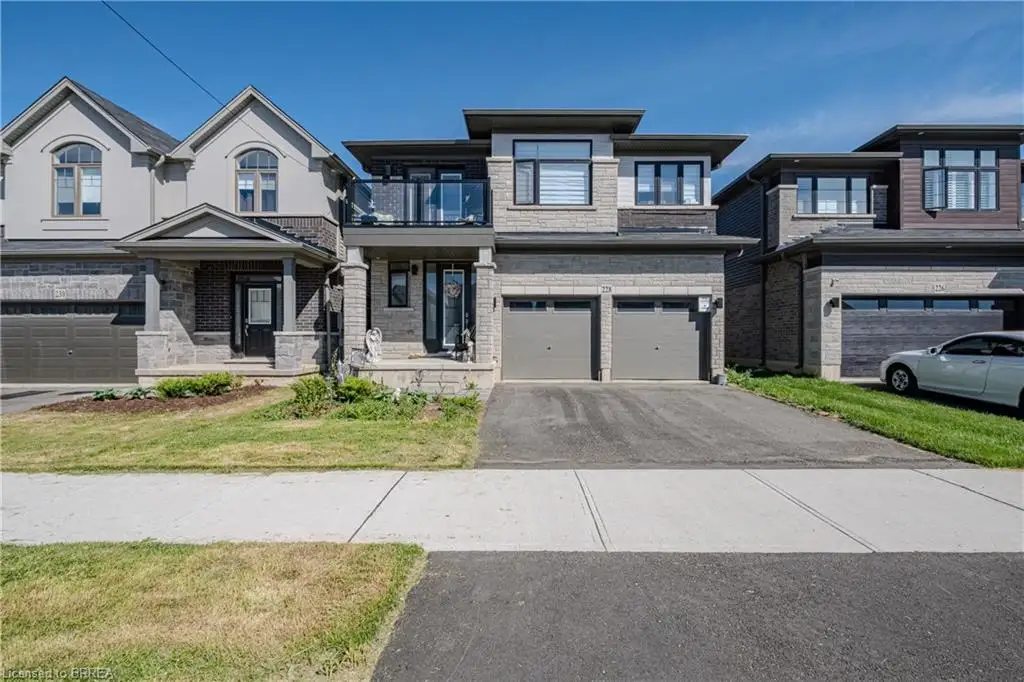 Contemporary stone and siding exterior with a flat roofline