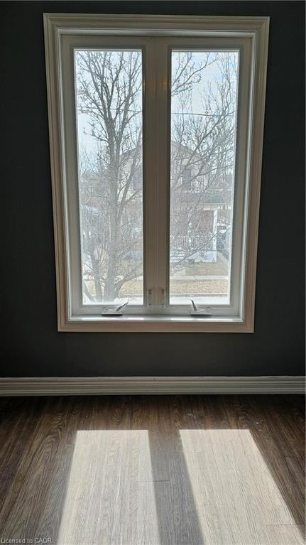 Detailed view of wood finished floors and baseboards
