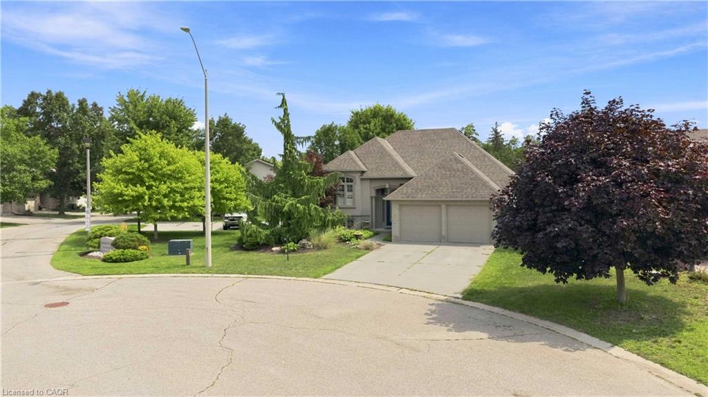 This home has great curb appeal with a concrete driveway, double attached garage, and beautiful landscaping