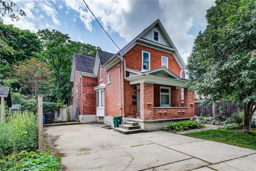 Brick exterior with gabled roofline and covered front porch
