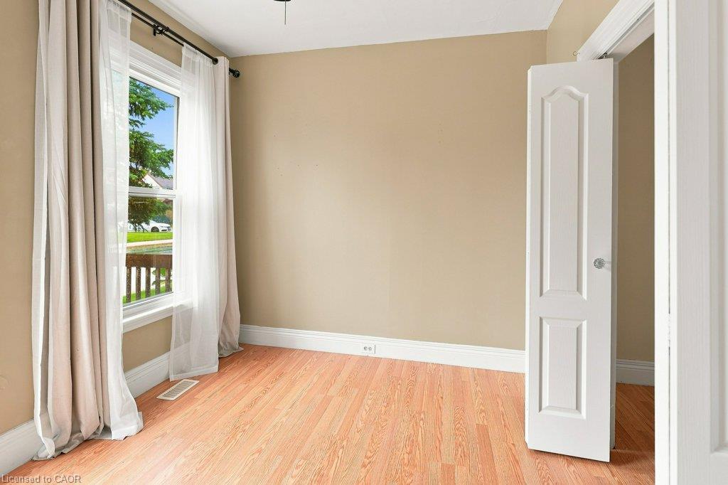 Wood-finish flooring with neutral wall tones and white trim
