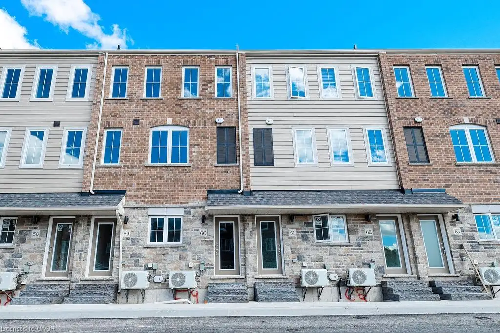 Modern townhome exteriors featuring a blend of brick, stone veneer, and horizontal siding