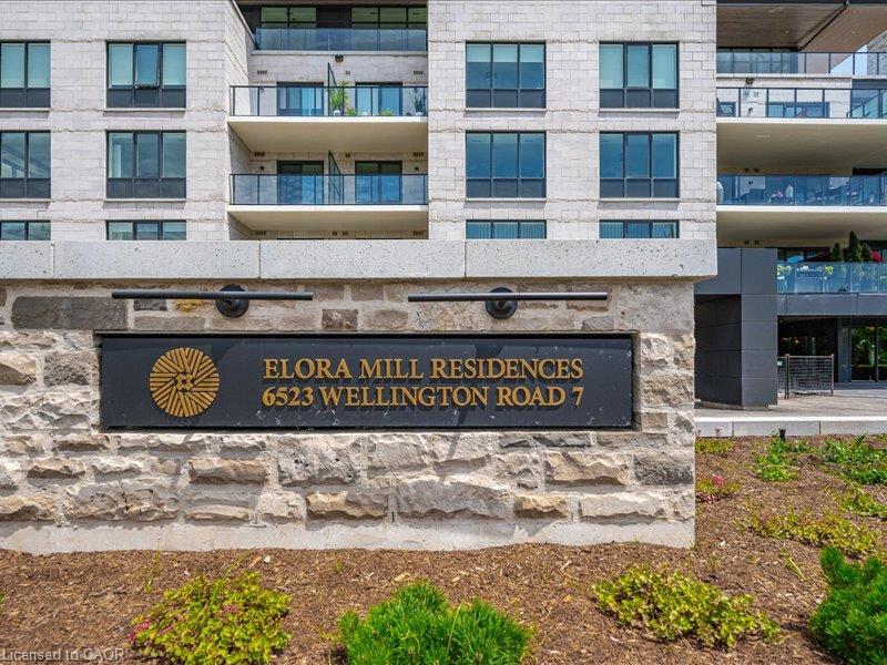 Stone facade with integrated signage and exterior lighting