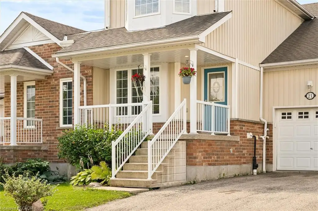Brick and siding exterior with a covered porch and a single car garage.