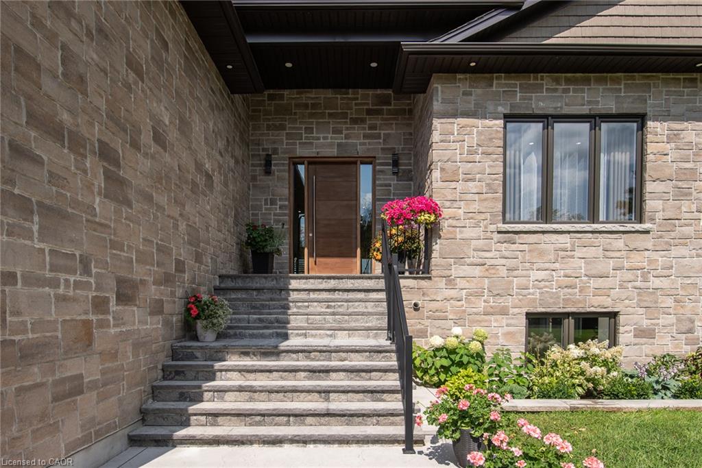 Stone masonry exterior with dark trim accents