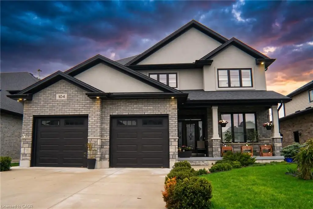 Two-story residence featuring a combination of brick and stucco finishes