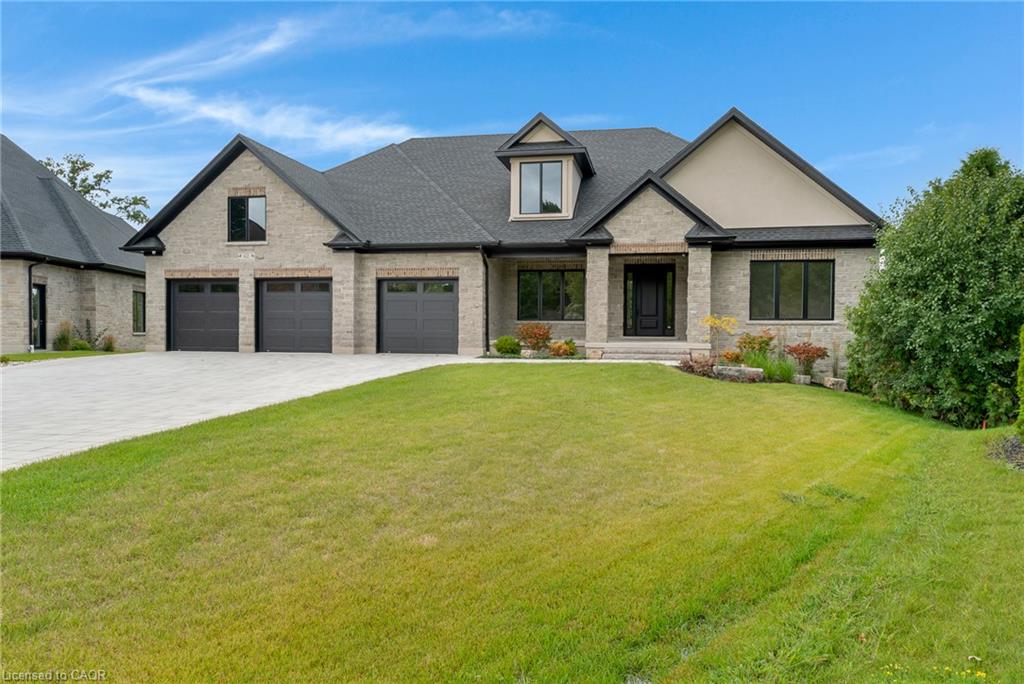 Stone and stucco exterior with dark trim accents