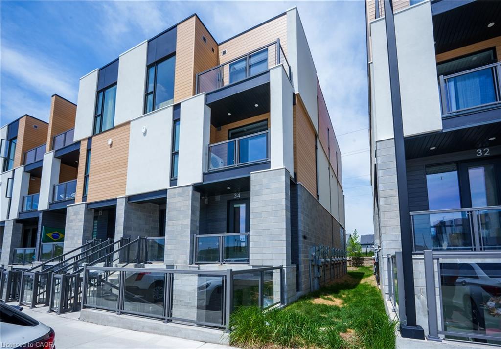 Modern multi-unit residential building featuring clean-lined architecture with mixed material exterior combining white panels and warm wood-finish accents