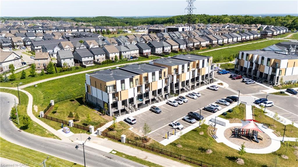 Modern multi-unit residential complex featuring clean-lined architecture with warm-toned exterior cladding and expansive glazing
