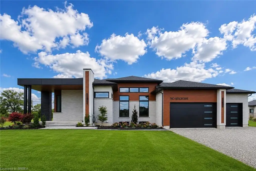 Modern architectural design with a light-colored brick exterior and wood-finish accents